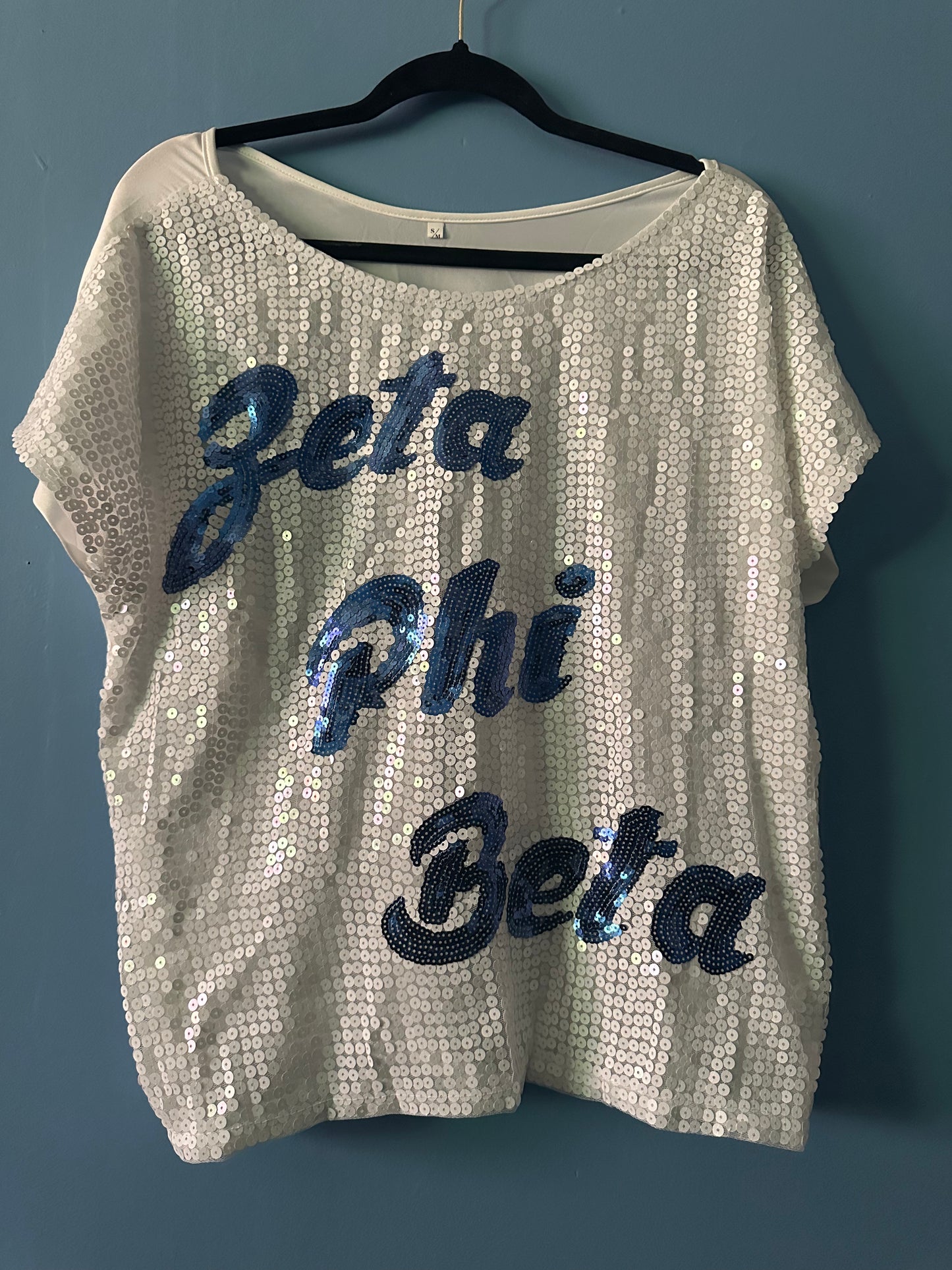 NWOT zeta phi beta sequin top 
Fit up to Large