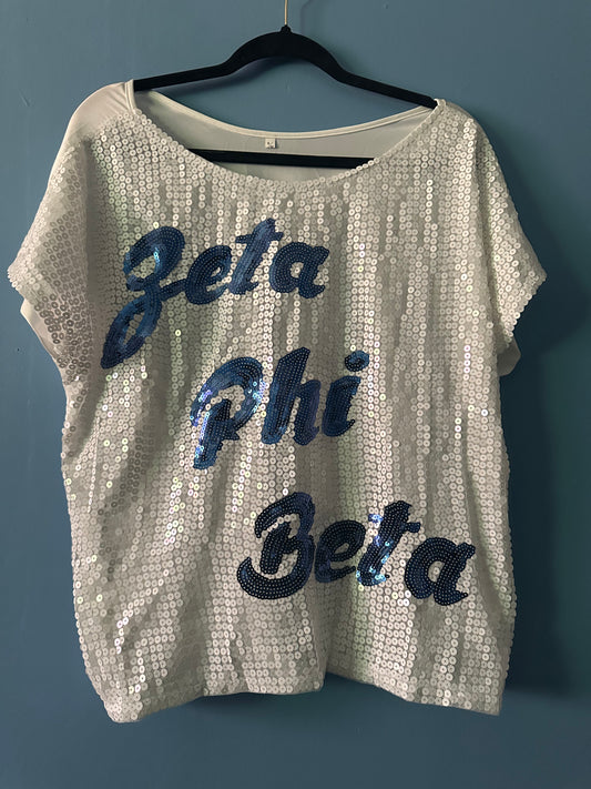 NWOT zeta phi beta sequin top 
Fit up to Large